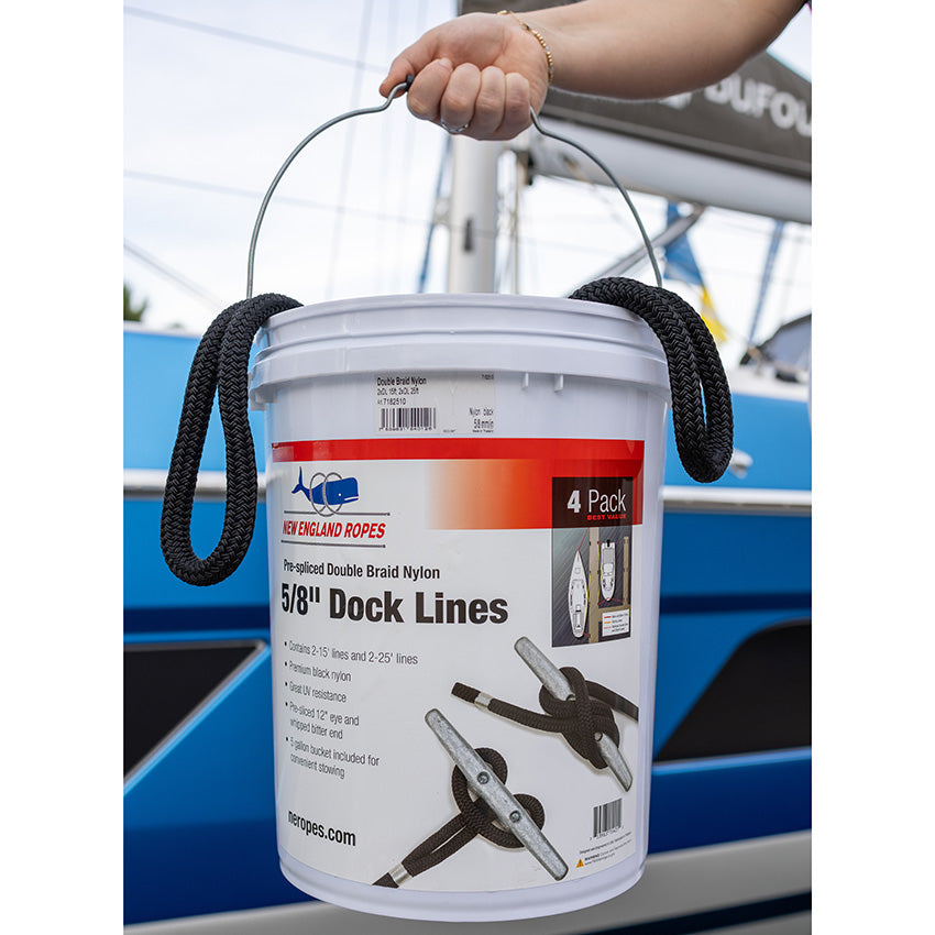 Woman's hand holding bucket containing pre-spliced black docklines. Graphics on bucket feature photo of dock lines tied around a cleat.
