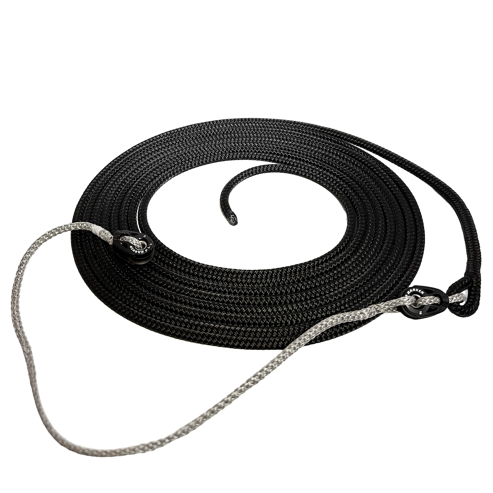 Black line with spliced eye on one end connected to grey Amsteel spectra line with harken pulleys at each end of the spectra line.