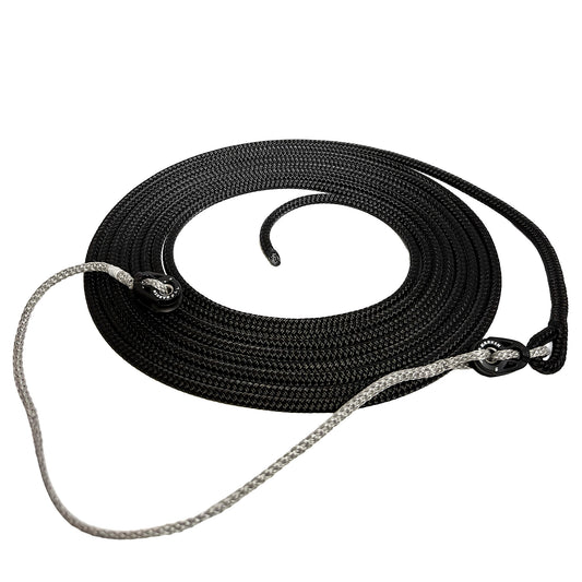 Black line with spliced eye on one end connected to grey Amsteel spectra line with harken pulleys at each end of the spectra line.