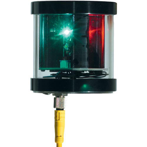 Nautical light with green and red lenses on a white background